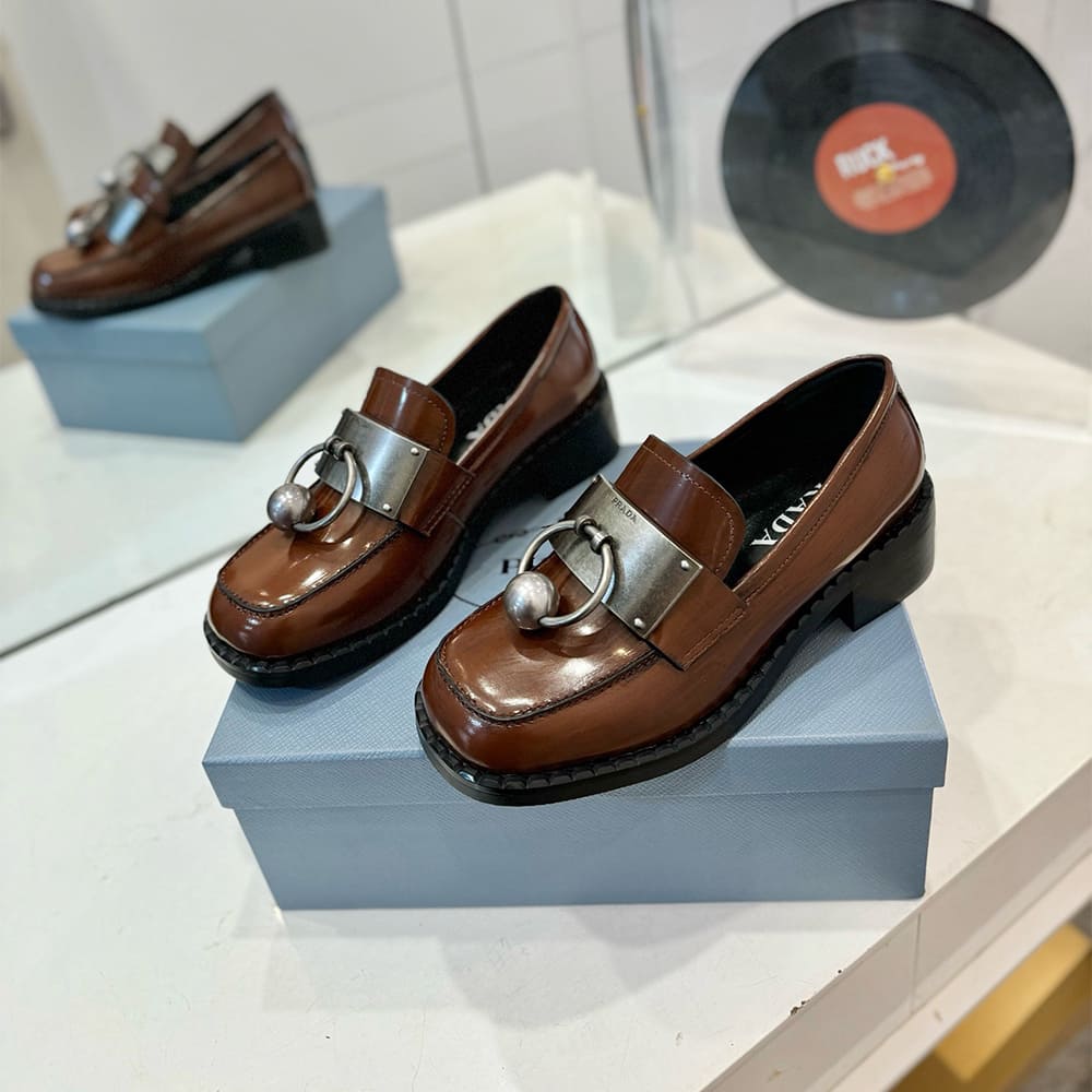 PRADA Brushed leather loafers with metal details